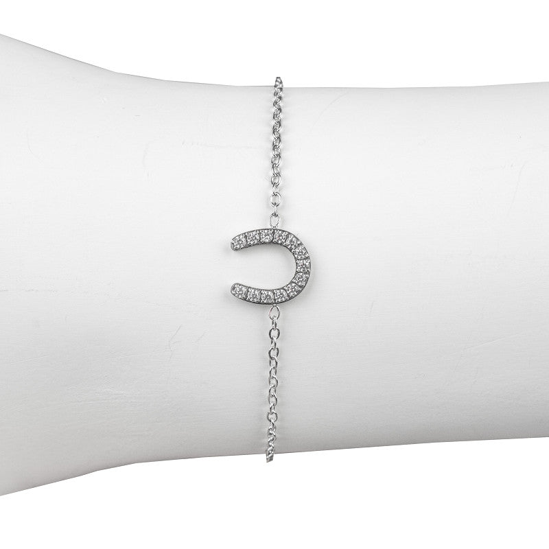 Horka armband met hoefijzer en strass steentjes. Gemaakt van roestvrijstaal en verstelbaar van 17–21 cm. Een stijlvol accessoire voor paardenliefhebbers.